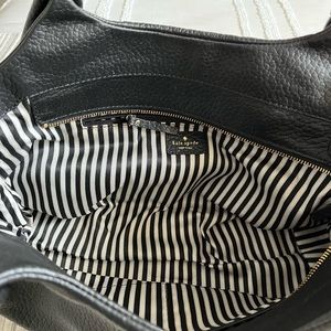 Black Kate Spade bag.